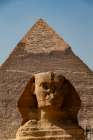 Africa, Egypt, Giza. Classic view of the Sphinx and one of the great Pyramids of Giza. Art Print
